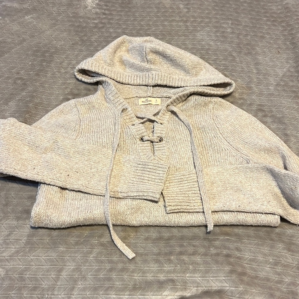 Cream colored knit lace up sweater
